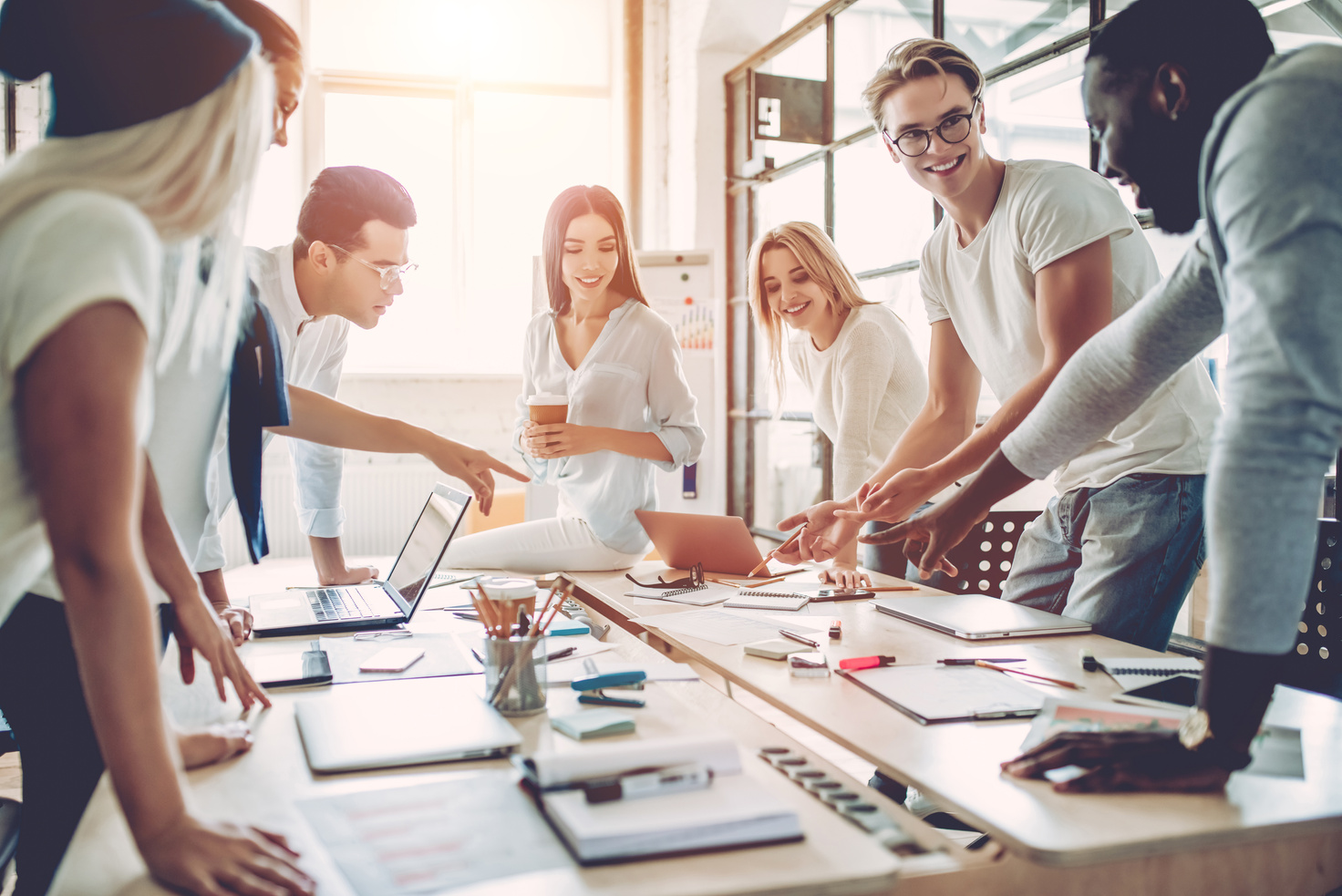 Young people work in modern office.